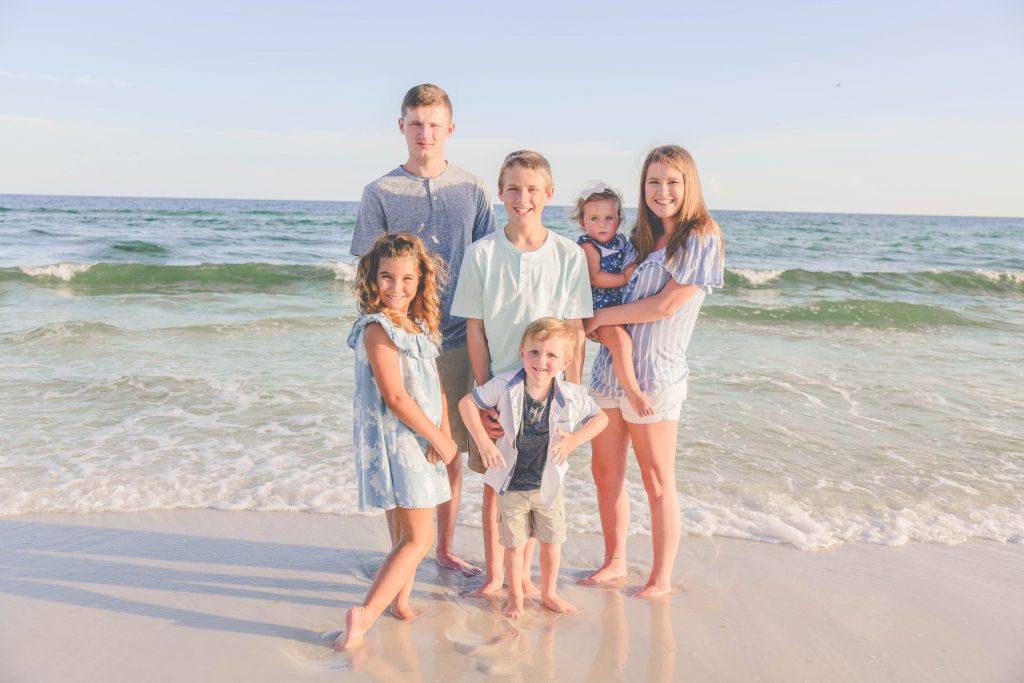 Kids standing on the shores of Fort Walton Beach, FL