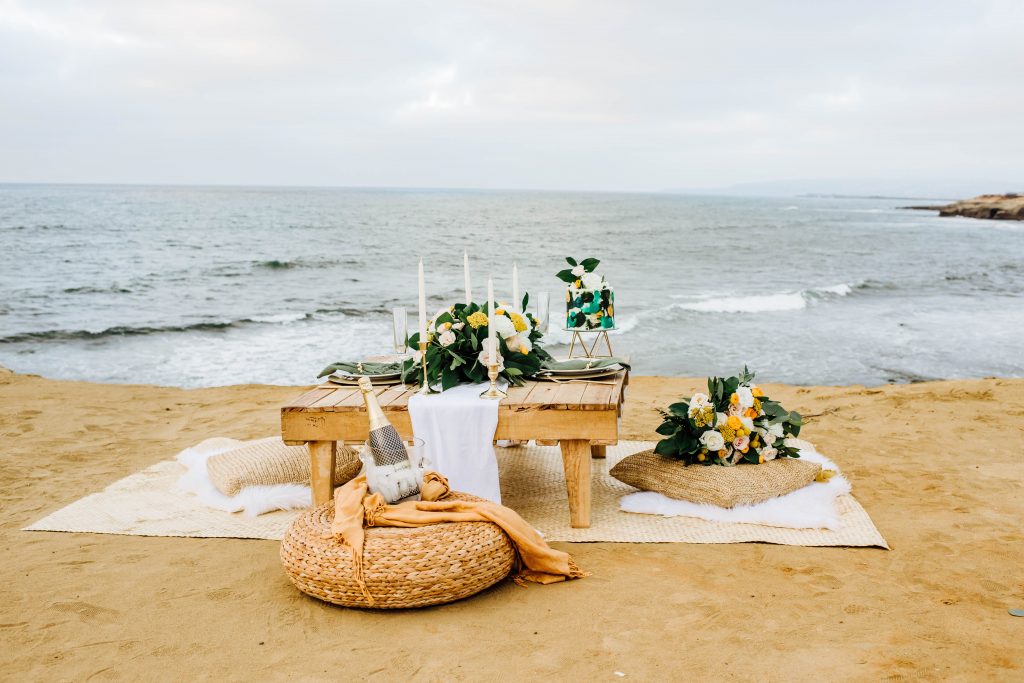 intimate vow renewal dinner at sunset cliffs in California overlooking the pacific ocean