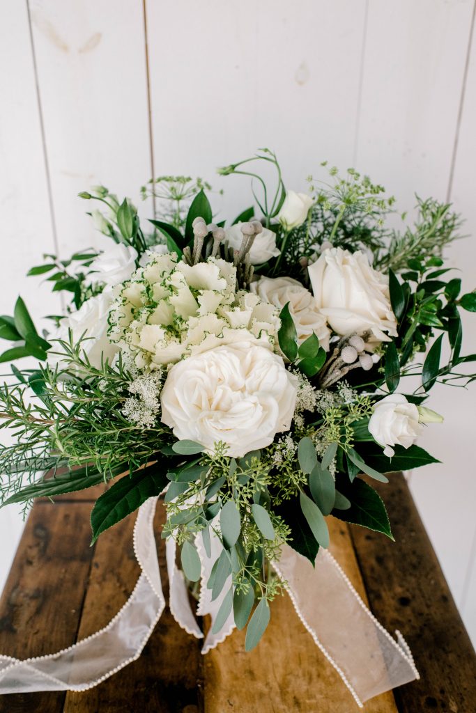 White florals paired with fresh greenery bridal bouquet made by Destin Floral Designs